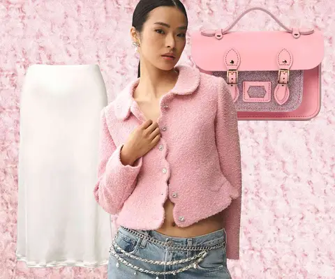 Pink handbag with glitter accents, pink tweed jacket on model, and white slip skirt