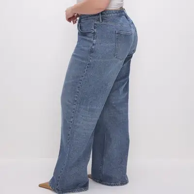 Good American Good Ease Relaxed Jeans in medium wash indigo on model