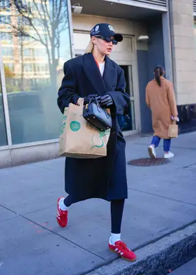 Gigi Hadid wearing red sneakers