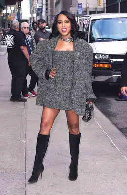 Kerry Washington wears a tweed dress and coat set, silver rose choker, and black knee-high boots