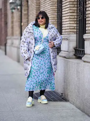 Model wearing a black puffer coat