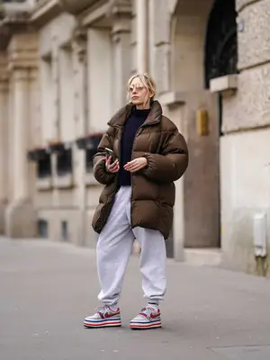 A model is wearing a leopard print wide leg pants