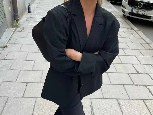 Matilda Djerf wears a black blazer and pants