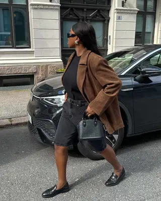 An influencer wearing a suede blazer. 