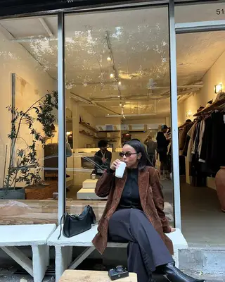 An influencer wearing a suede blazer. 