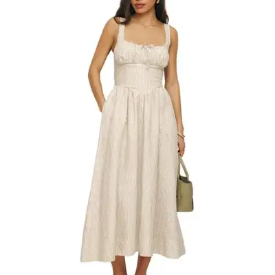 Reformation Balia Linen Dress in beige and white stripe on model styled with neutral handbag