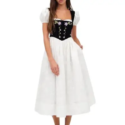 For Love & Lemons Lainey Midi Dress in white with black floral embroidered bodice on model