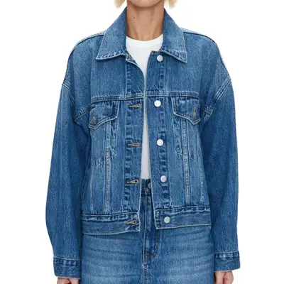 model wearing a mid-wash denim jacket