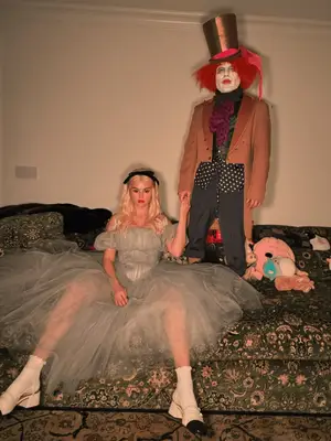 Selena Gomez and Benny Blanco dressed as Alice and the Mad Hatter from Alice in Wonderland.