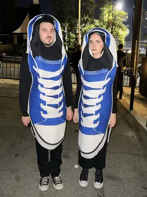 Maude Apatow and a friend wearing blue Converse sneaker Halloween costumes.