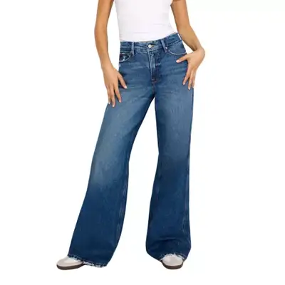 Model wearing wide-leg Good American jeans