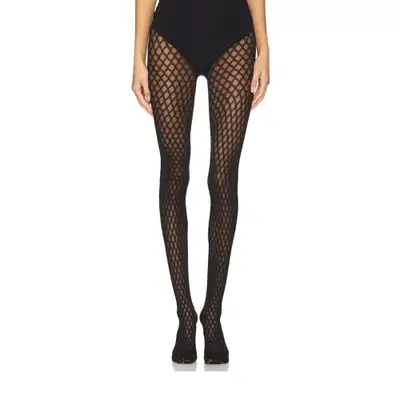 Model wearing black fishnet tights