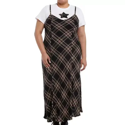 Model wearing a plaid slip dress and white t-shirt