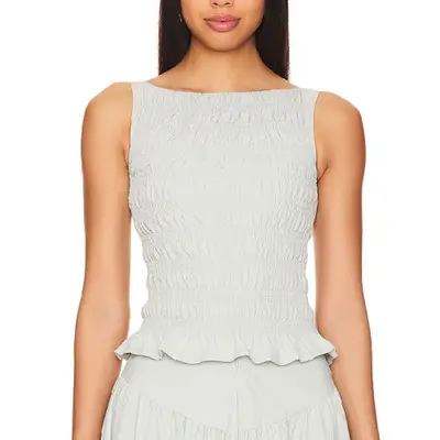 model wearing a white shirred top