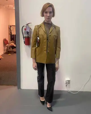 Hari Nef in a leather blazer