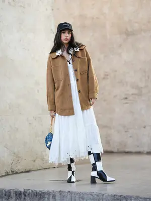 Gabriella Berdugo wears a white gathered and embroidered 