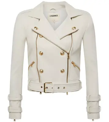 cream leather biker jacket with gold hardware against white background
