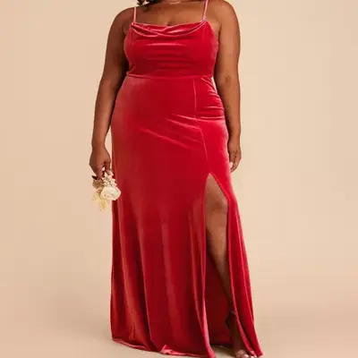 Model wearing a ruby red velvet maxi dress 