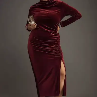 Model wearing a red velvet Ruched Cowl-Neck Dress: Velvet Long-Sleeve dress