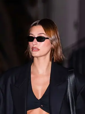 Hailey Bieber wearing black micro sunglasses