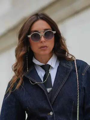 Gabriella Berdugo wearing sunglasses on a chain