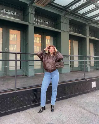 A content creator wearing skinny jeans. 