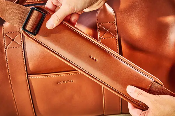 Close-up details of the shoulder strap of the Monos Metro Carry All Duffel