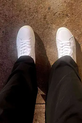 A closeup of a person wearing the Cariuma Salvas Leather Sneaker