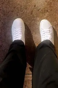 A closeup of a person wearing the Cariuma Salvas Leather Sneaker