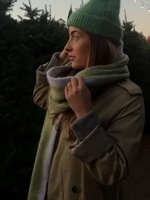 model wearing green trench coat