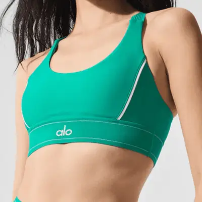 model wearing green sports bra