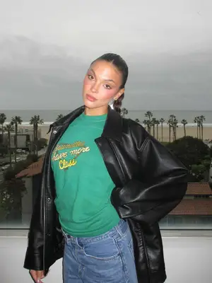 model wearing green cardigan