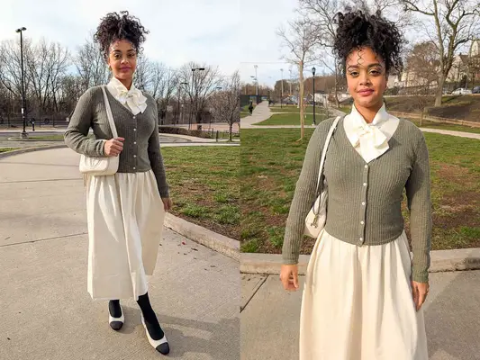 A woman wearing an Everlane Knit Crew Dress walking on a paved road