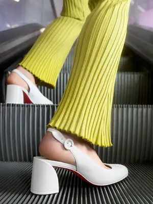 The Row Elastic Ballet Slipper in milk white leather with black strap