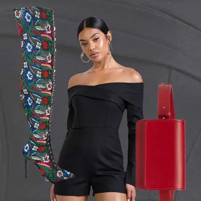 Black off-the-shoulder romper, floral embroidered thigh high boots, and red belt bag