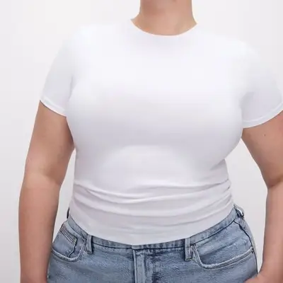 Good American Super Stretch Baby Tee in white on model