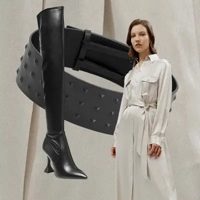 Button-down trench dress, black leather thigh high boots, and studded waist belt