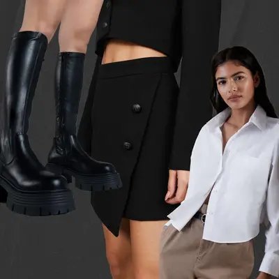 White button-down shirt, black buttoned mini skirt, and platform black thigh high boots