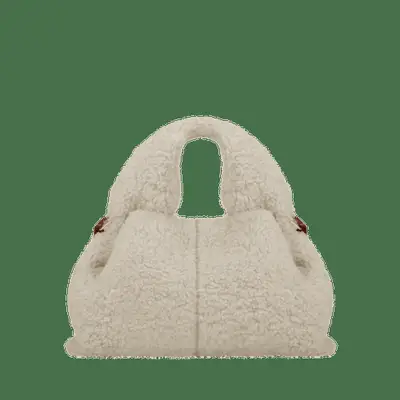 ecru shearling boucle top handle handbag against plain background