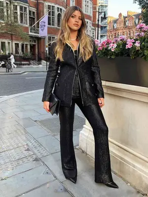 Sofia Richie Grainge wearing monochromatic all black sequin outfit of jacket, top, and pants