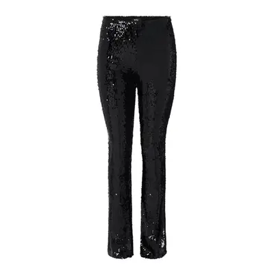 model wearing white jeans against plain background