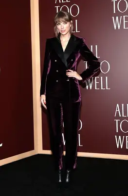 Taylor Swift wearing a plum velvet suit at the 