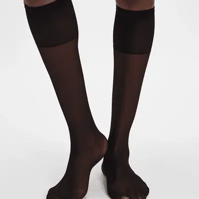 Free People City Cool Sheer Knee High Socks in black on model