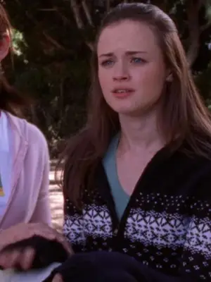 Rory Gilmore wears a black and white fair isle sweater with teal t-shirt underneath
