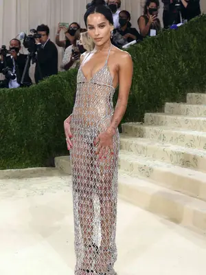 Zoe Kravitz wears a bedazzled netted Saint Laurent dress to the 2021 Met Gala