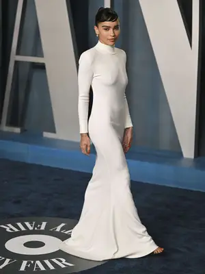 Zoe Kravitz wears a white bodycon backless gown by Saint Laurent to the 2022 Vanity Fair Oscars afterparty