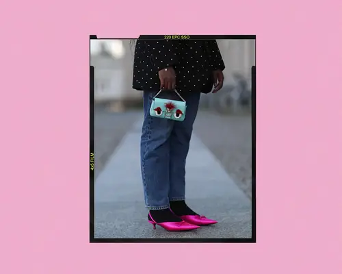 Woman wearing pink kitten heels