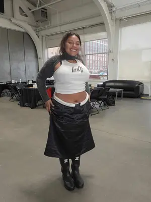 Paloma Elsesser wears a white 