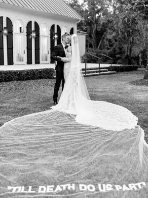 Hailey Bieber kisses Justin Bieber on their wedding day while wearing an Off-White gown with 