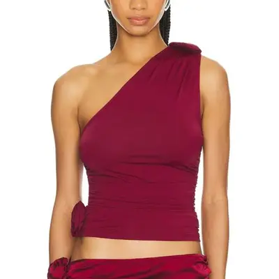 person wearing a one-shoulder red top